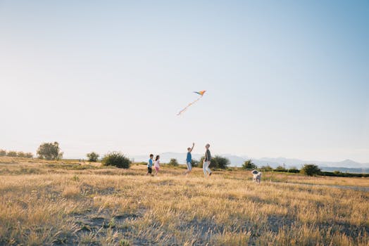 happy family playing with their dog