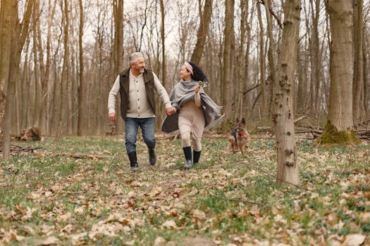 happy elderly couple with their pets