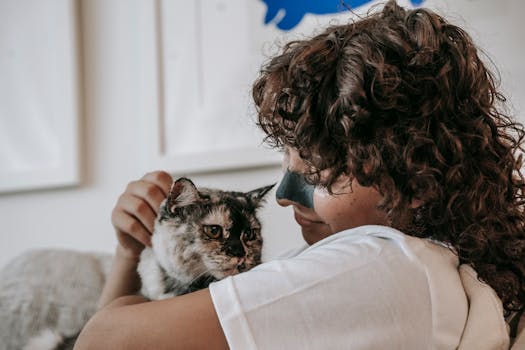 happy pet owner with their cat