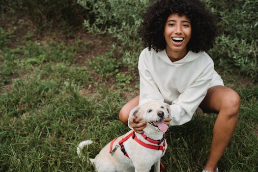 happy dog owner playing with dog