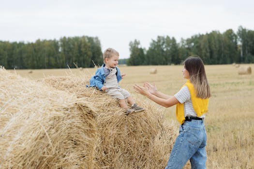 happy golden retriever playing with a child