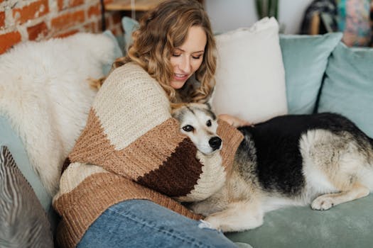 dog cuddling with owner