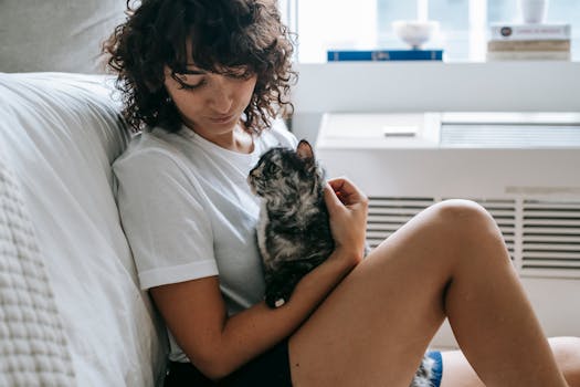 cat cuddling with owner