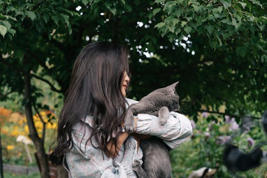 cat cuddling with owner